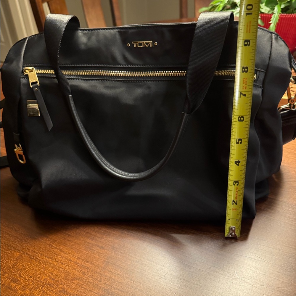 Tumi Black Handbag with Gold Details